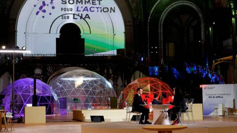 French President Emmanuel Macron answers journalists’ questions during an interview on the eve of the Artificial Intelligence (AI) Action Summit, at the Grand Palais - AFPpix