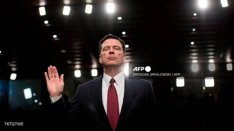 (FILES) Ousted FBI director James Comey is sworn in during a hearing before the Senate Select Committee on Intelligence on Capitol Hill June 8, 2017 in Washington, DC. -AFP