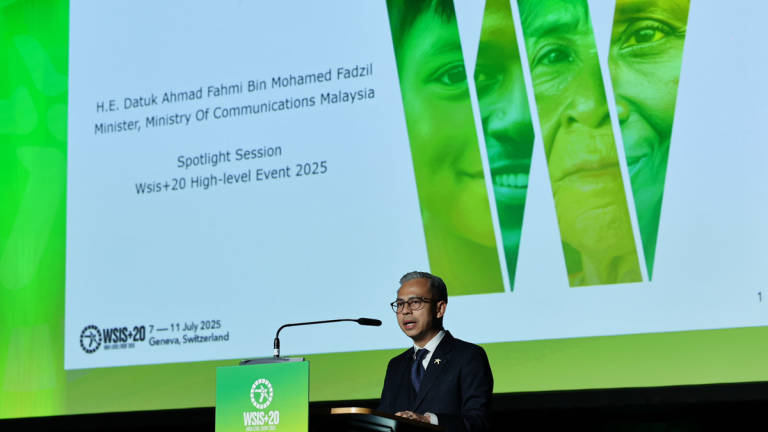 Communications Minister Datuk Fahmi Fadzil delivers a speech during a spotlight session at the World Summit on the Information Society+20 High-Level Event (WSIS+20) here, Wednesday. - BERNAMA