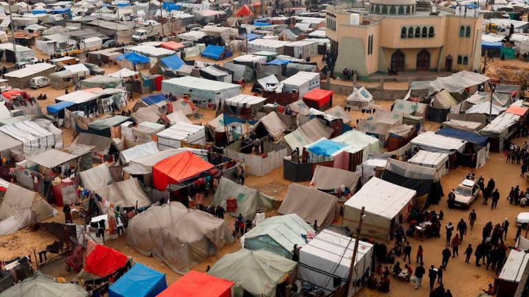 Displaced Palestinians, who fled their houses due to Israeli strikes, shelter at a tent camp, amid the ongoing conflict between Israel and Hamas, in Rafah in the southern Gaza Strip, February 27, 2024. - REUTERSPIX