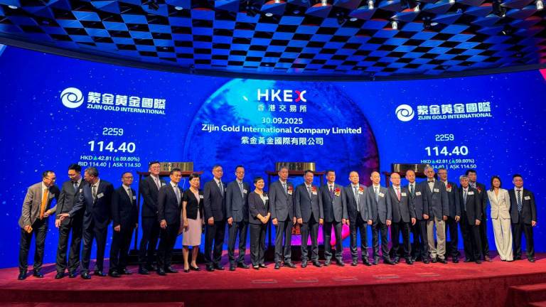 Chen Jinghe, Chairman of Zijin Mining, attends the listing ceremony of its subsidiary Zijin Gold International alongside board members and management at the Hong Kong Stock Exchange, in Hong Kong, China, September 30, 2025. REUTERS/Kane Wu