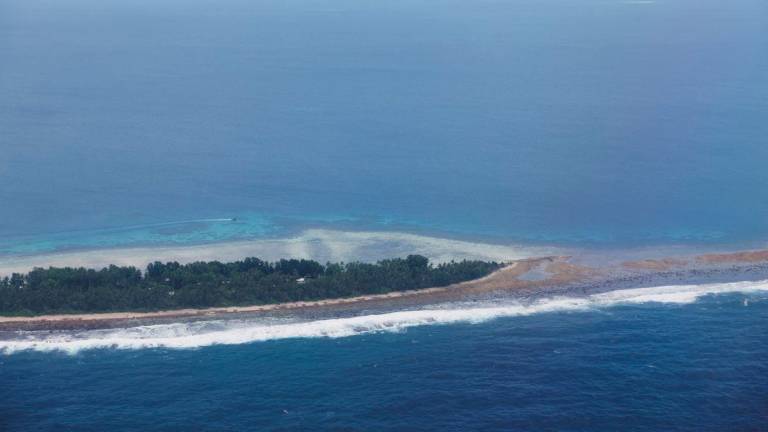 An aerial view of the Pacific Islands nation of Tuvalu, September 6, 2024. Rising sea levels caused by climate change have prompted the Tuvalu government to strike a climate migration pact with Australia. - REUTERSPIX