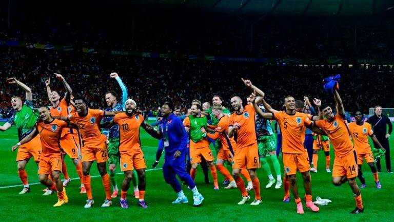 The Dutch players celebrate after the UEFA Euro 2024 quarter-final against Turkey at the Olympiastadion in Berlin - AFPpix