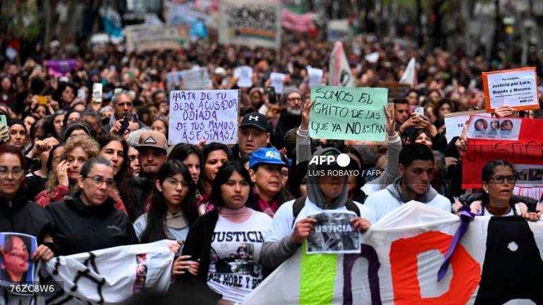 People attend a demonstration called by rights groups under the banner: “There are no good or bad victims, only femicides,“ referencing the three murdered teenagers’ alleged involvment in sex work, in Buenos Aires, on September 27, 2025. (Photo by Luis ROBAYO / AFP)