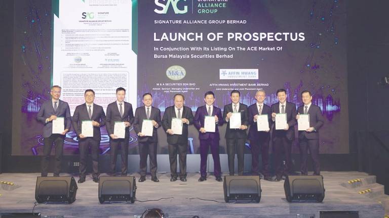 From left: Affin Hwang Investment Bank Bhd head of equity capital markets Arvin Chia, Signature Alliance Group Bhd promoter Melvin Ng, executive director Mario Foo, Chang, promoters Datuk Seri Chiau Beng Teik and Chiau Haw Choon, M&amp;A Equity Holdings Bhd managing director Datuk Bill Tan, M&amp;A Securities Sdn Bhd head of corporate finance Gary Ting, Chin Hin Group Bhd chief financial officer Michael Lim, and Signature International Bhd group CEO Lau Kock Sang at the prospectus launch.