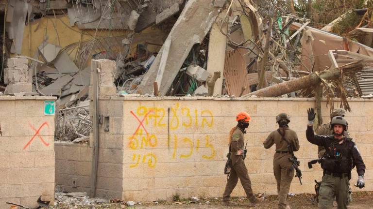 Israeli security forces and rescue teams rush to the scene of an Iranian strike that hit Ness Ziona in central Israel on June 22, 2025. (Photo by GIL COHEN-MAGEN / AFP)