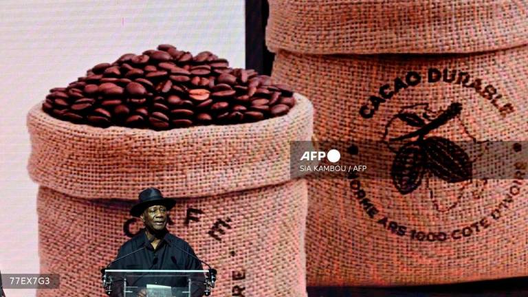 Ivorian President Alassane Ouattara delivers a speech during the opening ceremony of the 2025-2026 coffee and cocoa marketing campaign at the Abidjan Exhibition Centre on October 1, 2025. - AFP