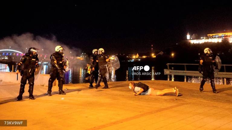 An anti-government protester is detained after clashes with police in the Serbian city of Novi Sad on September 5, 2025, after several thousand rallied seeking early elections. - AFP