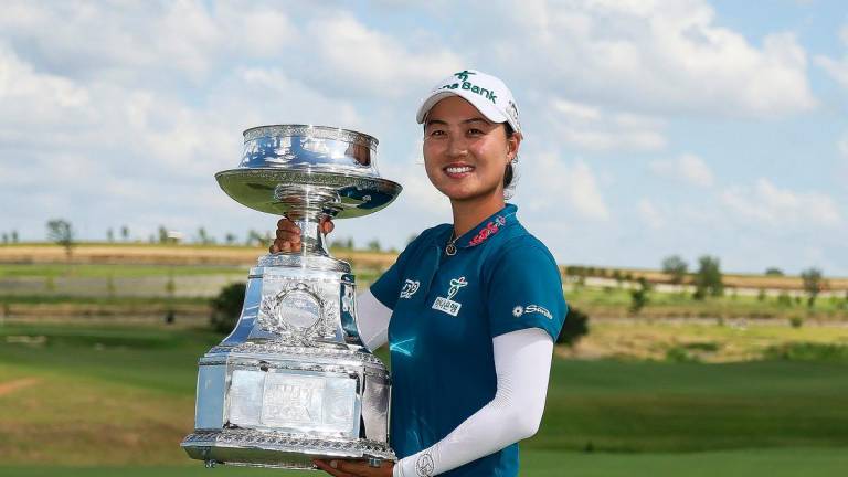 Minjee Lee of Australia poses with the trophy after winning the KPMG Women's PGA Championship 2025. – Getty Images