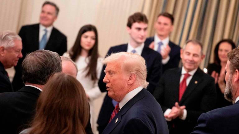 US President Donald Trump arrives during a dinner for Republican US Senators in the State Dining Room of the White House July 18, 2025, in Washington, DC. - AFP