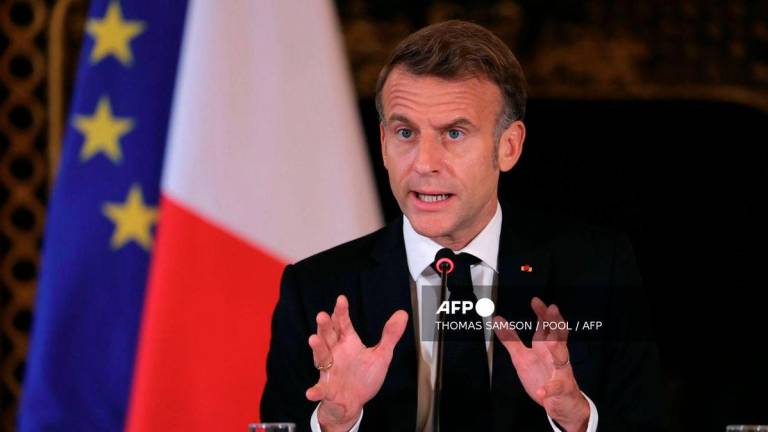 France's President Emmanuel Macron speaks during a Ministerial meeting on the implementation of the Middle East peace plan at the Quai d'Orsay, France's Ministry for Europe and Foreign Affairs, in Paris, on October 9, 2025. - Pool via AFP