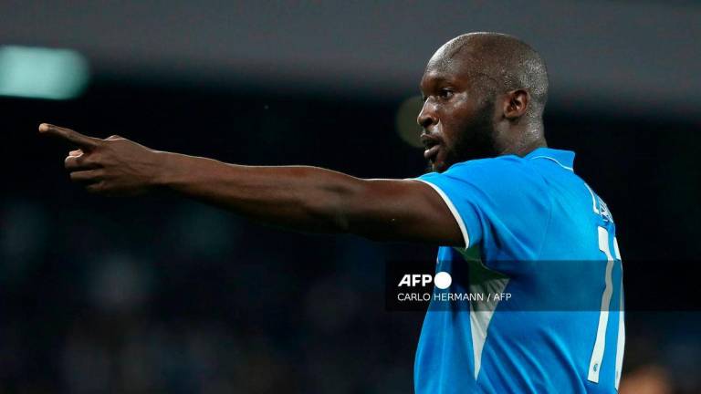 Napoli's Belgian forward #11 Romelu Lukaku celebrates after scoring a goal during the Italian Serie A football match between Napoli and AC Milan at the Stadio Diego Armando Maradona in Naples, on March 30, 2025. - AFP