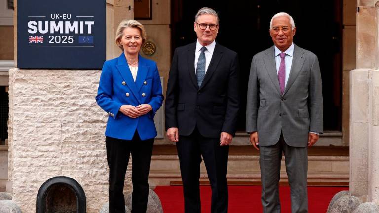 Britain’s Prime Minister Keir Starmer poses with European Commission President Ursula von der Leyen and European Council President Antonio Costa as they arrive to attend the UK-EU Summit at Lancaster House in London on May 19, 2025. HENRY NICHOLLS/Pool via REUTERS