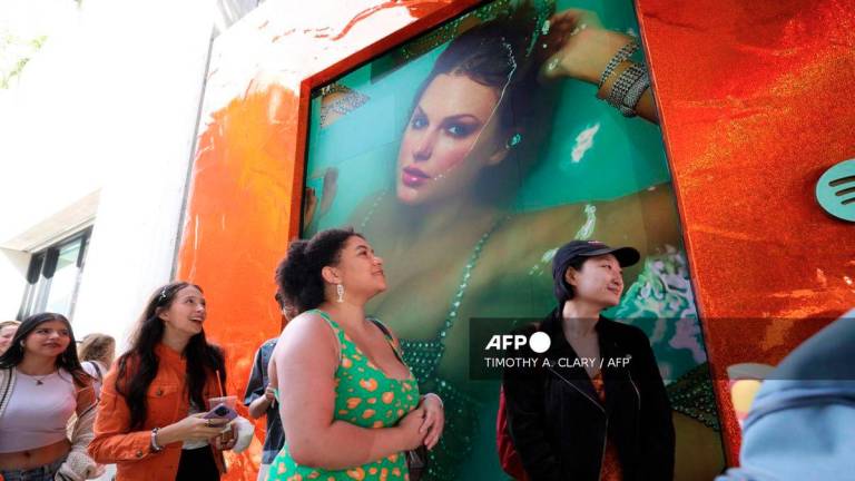 Fans of US musician Taylor Swift, also known as Swifties, wait in line to attend The Life of a Showgirl pop-up event at Spotify's three-day immersive experience in New York on October 2, 2025, to celebrate Swift's upcoming album The Life of a Showgirl.. - AFP