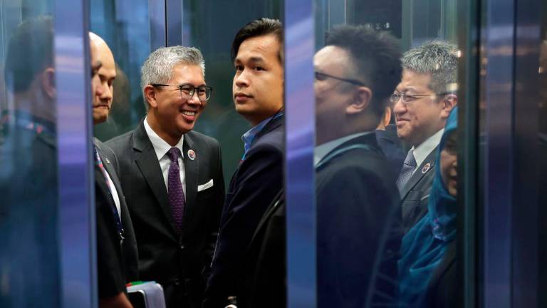 Minister of Investment, Trade and Industry Tengku Datuk Seri Zafrul Abdul Aziz arrives at the Malaysia International Trade and Exhibition Centre (MITEC) for the 5th ASEAN Geoeconomic Task Force (5th AGTF) meeting today. Also present is Deputy Minister of Investment, Trade and Industry Liew Chin Tong. - BERNAMA