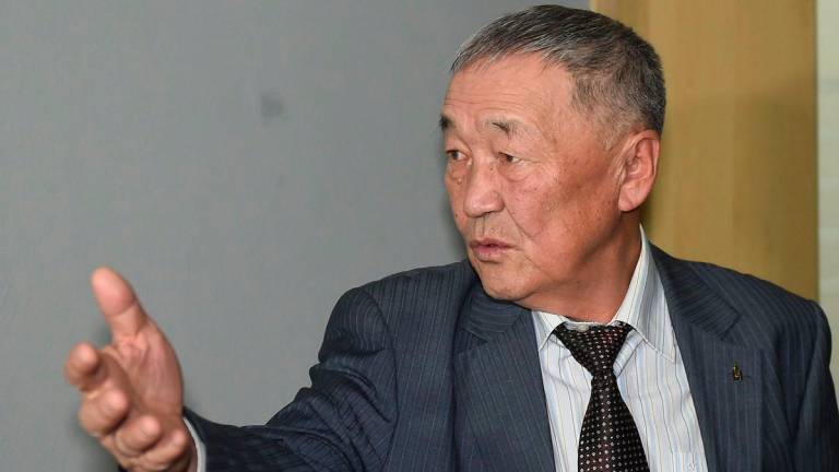 Setev Shaariibuu, the father of murdered young Mongolian woman Altantuya Shaariibuu, who is expected to testify in a civil lawsuit into her daughter's murder arrives in court in Sha Alam on January 22, 2019. - AFP