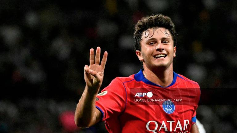 Paris Saint-Germain's Portuguese midfielder #87 Joao Neves celebrates scoring his team's sixth goal and his third goal during the French L1 football match between Toulouse FC and Paris Saint-Germain at The TFC Stadium in Toulouse, southwestern France on August 30, 2025. - AFP
