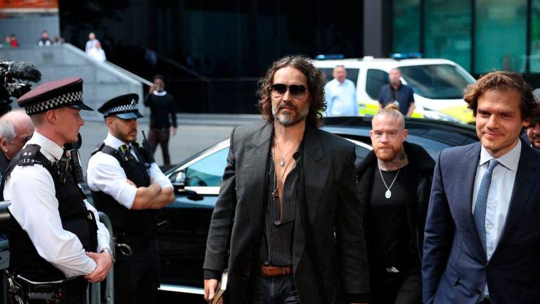 British comedian and actor Russell Brand (C) arrives to Southwark Crown Court in south London on May 30, 2025 - AFPpix