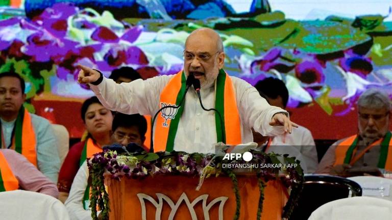 Amit Shah, India’s Minister of Home Affairs and leader of the Bharatiya Janata Party (BJP) addresses party activists during a gathering in Kolkata on June 1, 2025. (Photo by Dibyangshu SARKAR / AFP)