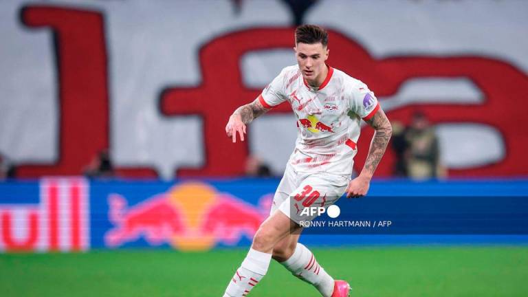 Leipzig's Slovenian forward #30 Benjamin Sesko plays the ball during the German first division Bundesliga football match between RB Leipzig and Borussia Dortmund in Leipzig, eastern Germany on March 15, 2025. - AFP