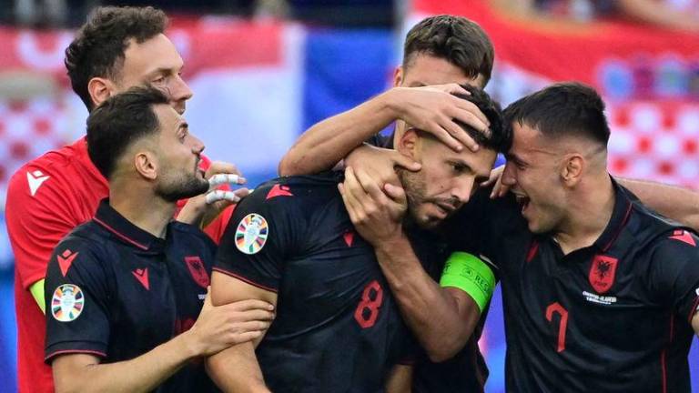Albania's midfielder Klaus Gjasula celebrates with his team mates after scoring the equalising goal 2:2 during the UEFA Euro 2024 Group B football match between Croatia and Albania - AFPpix