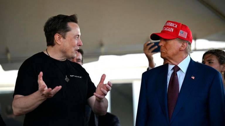 Elon Musk speaks with U.S. President-elect Donald Trump - AFPpix