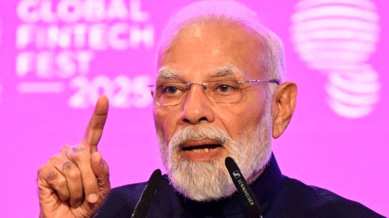 Indian Prime Minister Narendra Modi speaks at the Global Fintech Fest, during a visit by British Prime Minister Keir Starmer (not pictured), on October 9, 2025, in Mumbai, India. Leon Neal/Pool via REUTERS