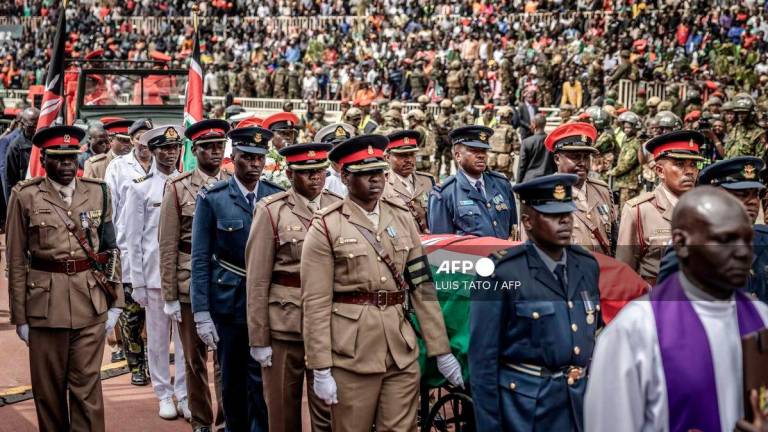 Senior Kenya Army officials flank the coffin of Kenya’s opposition leader and former Prime Minister Raila Odinga during his State Funeral at Nyayo Stadium in Nairobi on October 17, 2025. - AFP