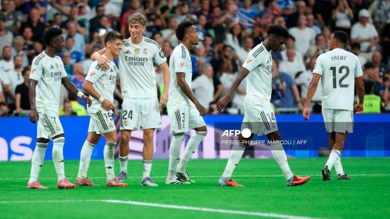 Real Madrid's Turkish midfielder #15 Arda Guler (2L) celebrates with teammates a goal that was later annulled during the Spanish league football match between Real Madrid CF and Real RCD Mallorca at the Santiago Bernabeu stadium in Madrid on August 30, 2025. - AFP