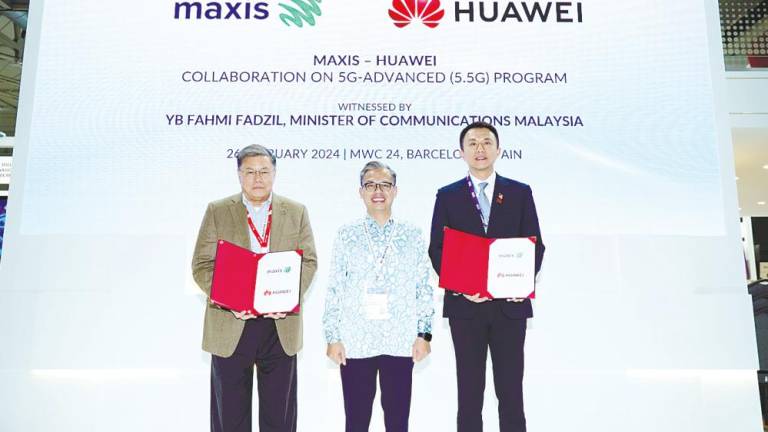 Fahmi (centre) with Goh and Sun at the MoU signing ceremony held at Malaysia Pavilion during Mobile World Congress 2024 in Barcelona, Spain.