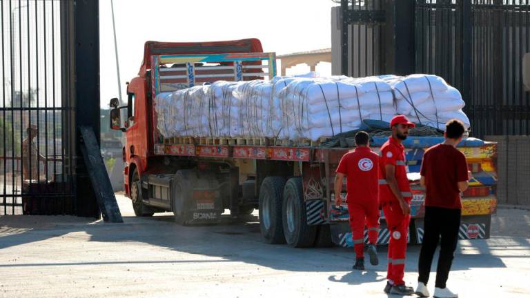 A truck loaded with humanitarian aid drives toward the Gaza Strip through the Egyptian side of the Rafah crossing on July 27, 2025. (Photo by AFP)