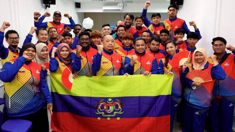 Federal Territory Deaf athletes pose for a photo at the Flag-Off Ceremony of the Federal Territory Deaf Athletes Contingent to the 22nd Malaysia Deaf Sports Games to be held in Kuching, Sarawak. – BERNAMA