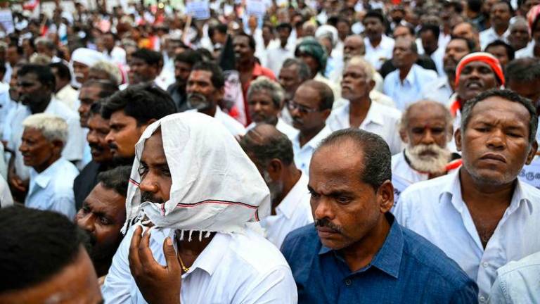 Members of All India Anna Dravida Munnetra Kazhagam (AIADMK) party protest against toxic alcohol that led to the death of residents at Kallakurichi in India's Tamil Nadu state - AFPpix