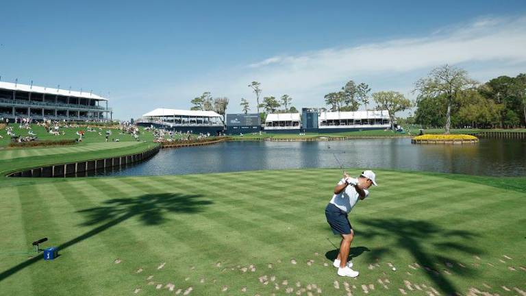 Si Woo Kim hitting his tee shot on the par-3 17th hole during practice ahead of The Players Championship.– GETTY IMAGES