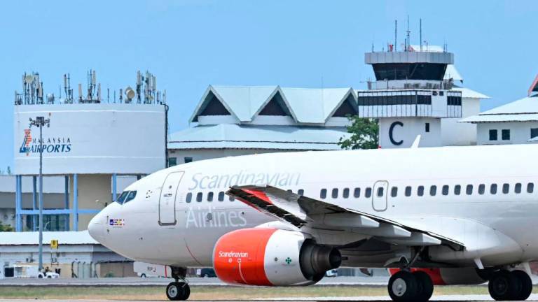 A Scandinavian Airlines (SAS) Boeing 737-700 aircraft believed to carry Norway’s King Harald V prepares for take-off on the runway at Langkawi International Airport on the Malaysian resort island of Langkawi on March 3, 2024, after an infection forced him to be hospitalised while on holiday/AFPPix