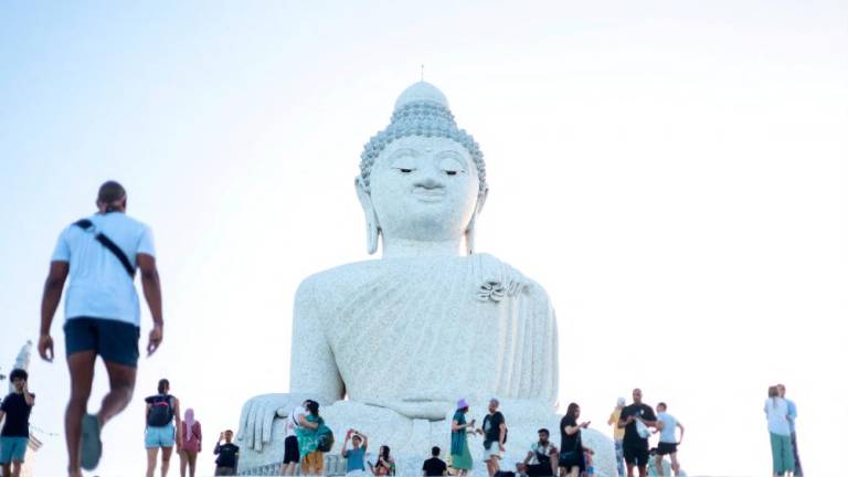 Filepix: Tourists visit the Big Buddha statue in Phuket, Thailand/REUTERSPix