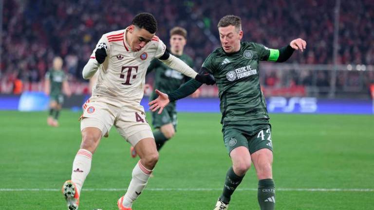 Bayern Munich's German midfielder #42 Jamal Musiala and Celtic's Scottish midfielder #42 Callum McGregor vie for the ball during the UEFA Champions League second-leg, knockout phase play-off match FC Bayern Munich vs Celtic on February 18, 2025 in Munich. - AFPPIX