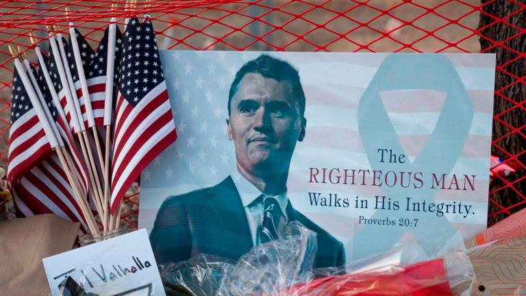 A poster of conservative activist Charlie Kirk is displayed at a memorial following the fatal shooting of Kirk, at the Turning Point USA headquarters in Phoenix, Arizona, U.S., September 12, 2025. REUTERS/Thomas Machowicz