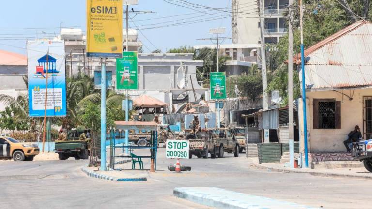 Somalian military vehicles are seen in a street near a hotel in Mogadishu on March 15, 2024/AFPPix