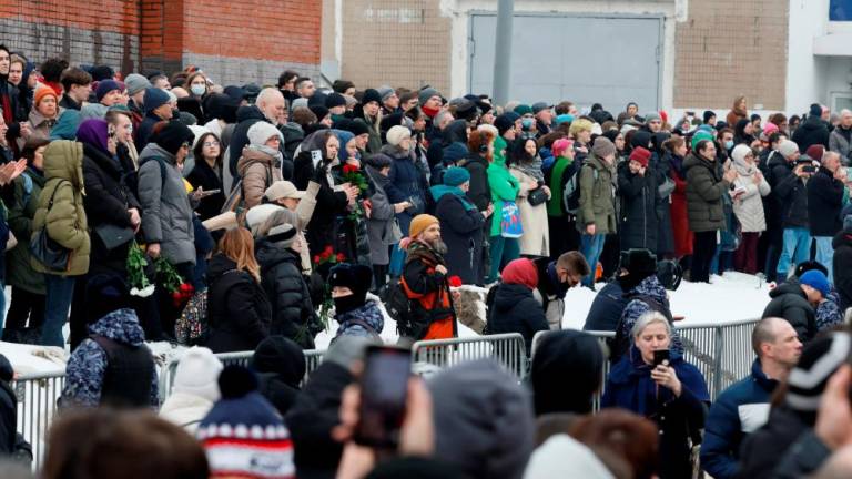 People gather near the Soothe My Sorrows church, where a funeral service and a farewell ceremony for Russian opposition politician Alexei Navalny are held, in Moscow, Russia, March 1, 2024/REUTERSPix