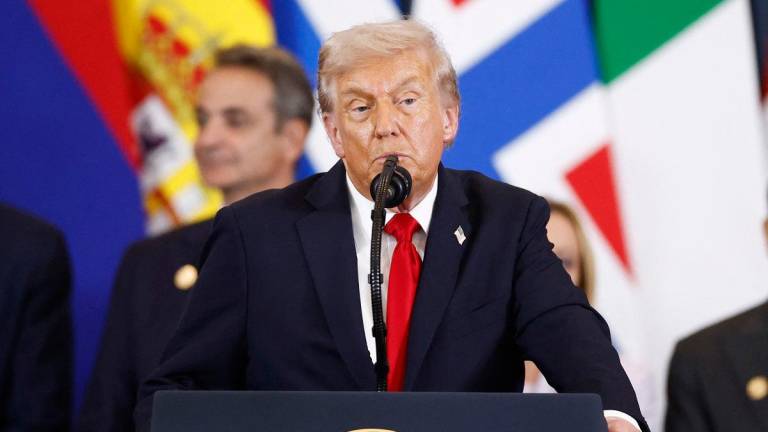 US President Donald Trump delivers a speech during the Gaza Peace Summit in Sharm El-Sheikh, on October 13, 2025. - Yoan VALAT / POOL / AFP