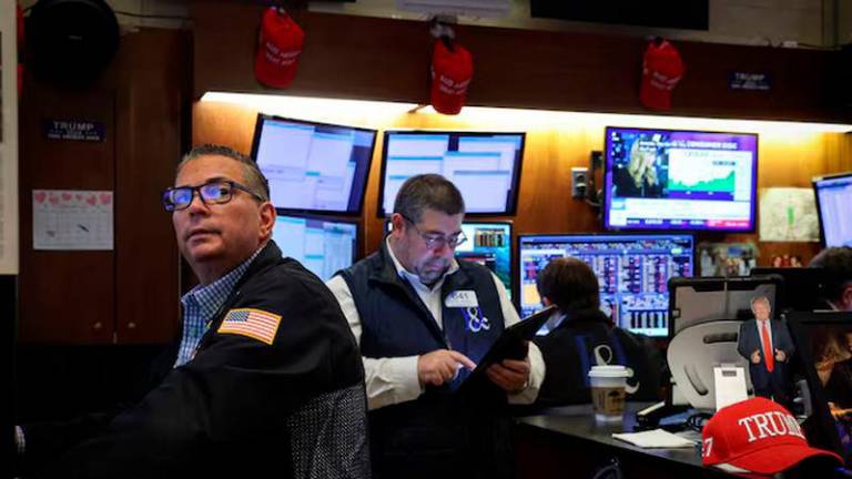 Traders work on the floor at the New York Stock Exchange (NYSE) in New York City - REUTERSpix