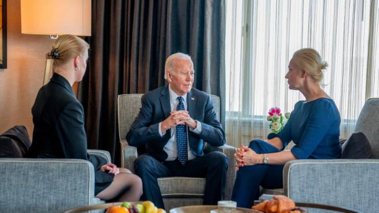 In this photo courtesy of The White House, obtained on February 22, 2024, US President Joe Biden (C) meets with Yulia Navalnaya (R), widow of Kremlin opposition leader Alexei Navalny, who died last week in a Russian prison, and daughter Dasha Navalnaya (L) in San Francisco, California. - AFPPIX