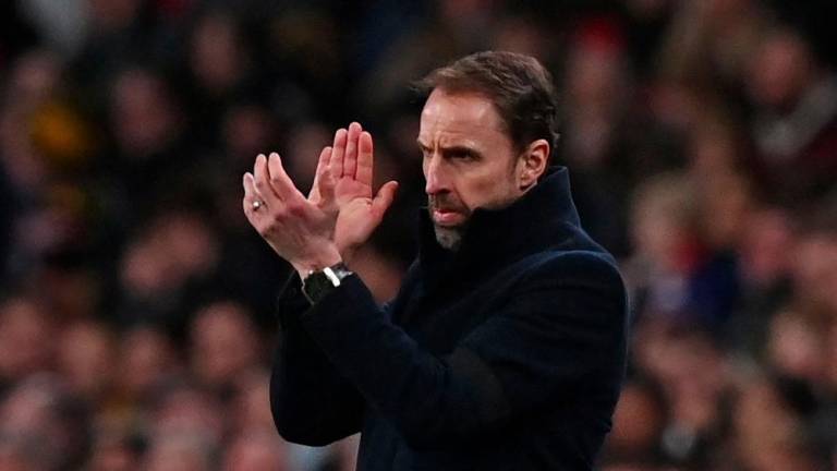 England's manager Gareth Southgate gestures on the touchline during the international friendly football match between England and Brazil at Wembley stadium in north London on March 23, 2024. - AFPPIX