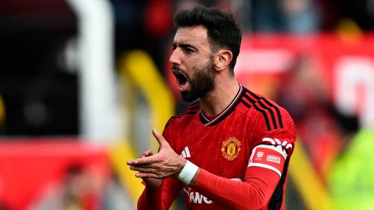Manchester United’s Portuguese midfielder #08 Bruno Fernandes gestures during the English FA Cup Quarter Final football match between Manchester United and Liverpool at Old Trafford in Manchester, north west England, on March 17, 2024/AFPPix