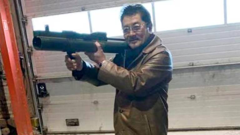 Takeshi Ebisawa poses with a rocket launcher at a warehouse in Copenhagen, Denmark - REUTERSpix