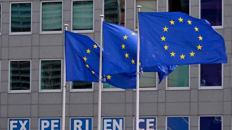 This photograph shows European flags outside the EU headquarters in Brussels on May 6, 2025.AFPpix