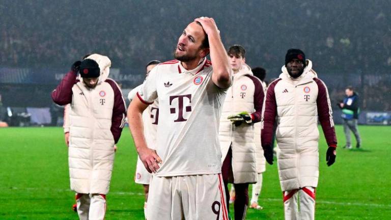 Bayern Munich's English forward #09 Harry Kane (C) reacts at the end of the UEFA Champions League, league phase day 7, football match between Feyenoord (NED) and FC Bayern Munich (GER) at the Feyenoord Stadium in Rotterdam, on January 22, 2025. - AFPPIX