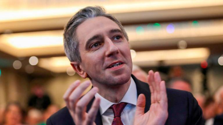 Simon Harris applauds during the Fine Gael convention at the Sheraton Hotel in Athlone, central Ireland on March 24, 2024, before being declared leader and de facto prime minister-in-waiting/AFPPix