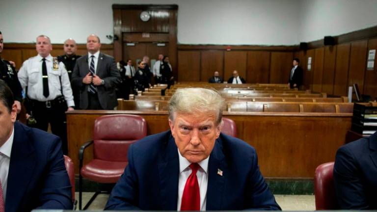 Former US President Donald Trump attends the first day of his trial for allegedly covering up hush money payments linked to extramarital affairs, at Manhattan Criminal Court in New York City on April 15, 2024/AFPPix